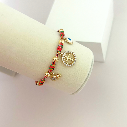 Adjustable faith bracelet featuring crystal cross charm and evil eye detail.