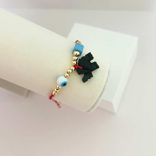 Pulsera ajustable de protección con ojo turco, cuentas doradas, cordón rojo y dije negro de azabache para mujer.