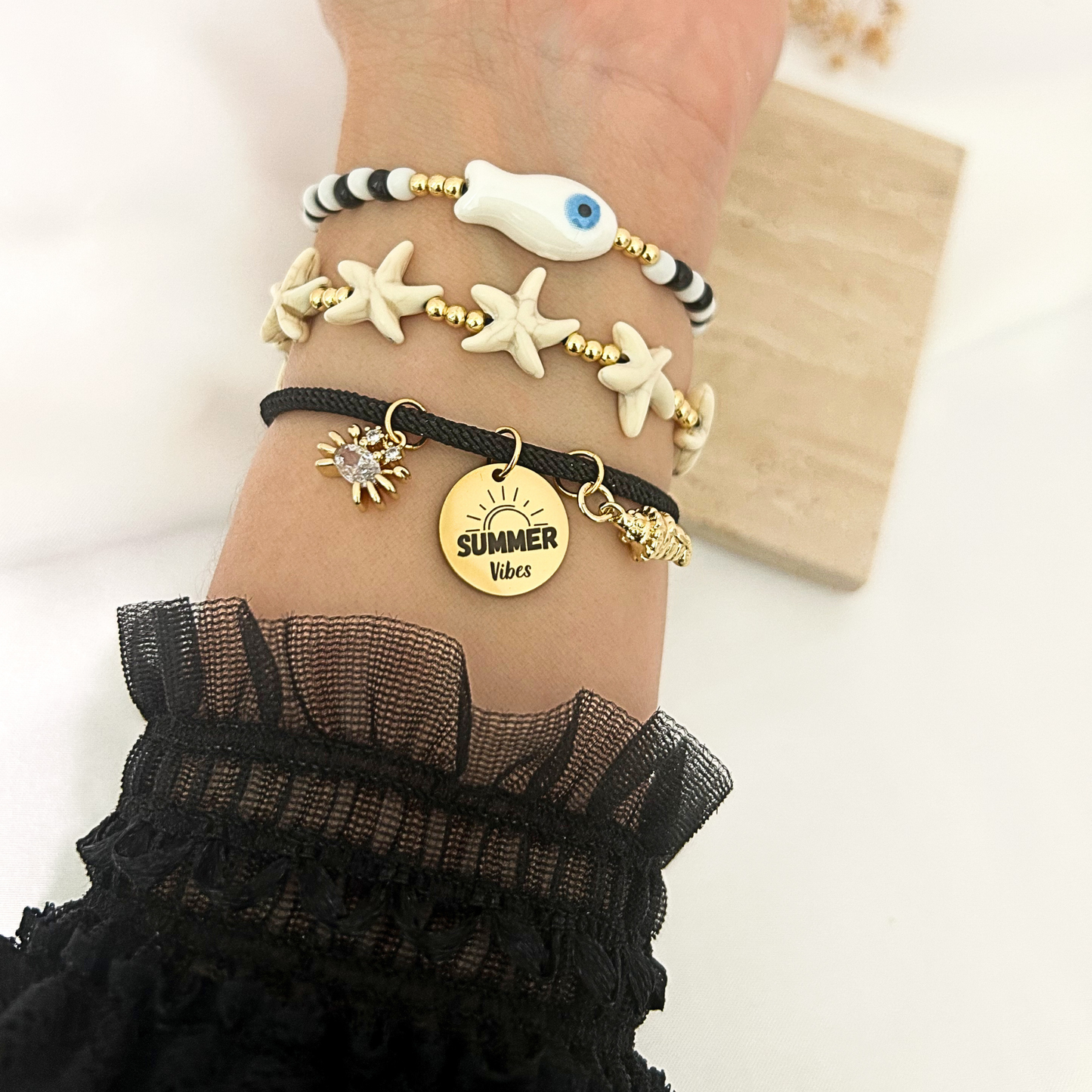 Beach stack bracelet set with evil eye, starfish, and summer vibes charms