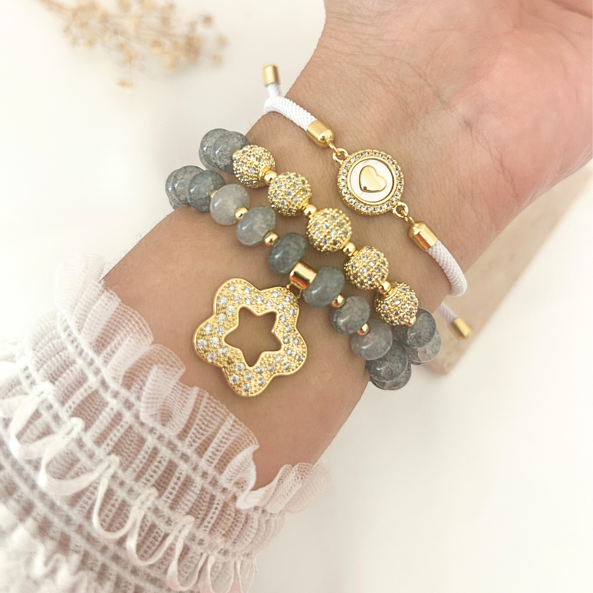 Gray crystal bracelet stack worn on wrist