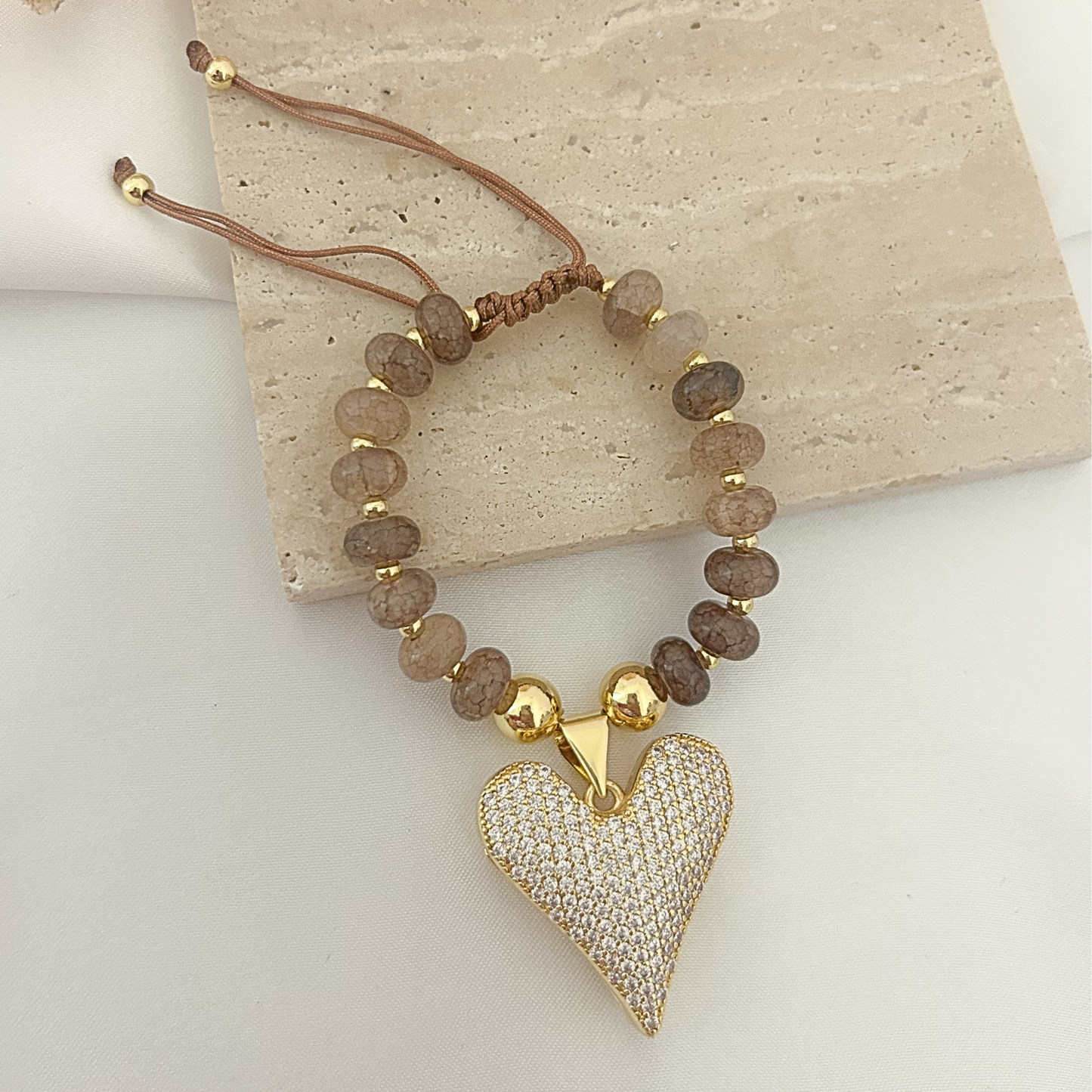 Beaded bracelet with stone-imitation beads and oversized pavé heart pendant