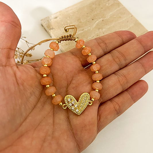 Peach crystal bracelet with pavé heart charm