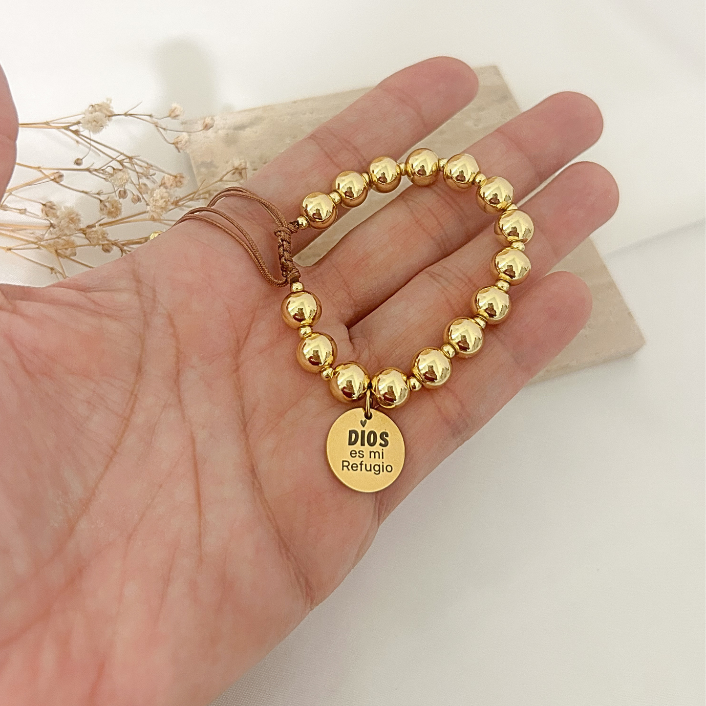 Gold bead bracelet with “Dios Es Mi Refugio” engraved faith charm