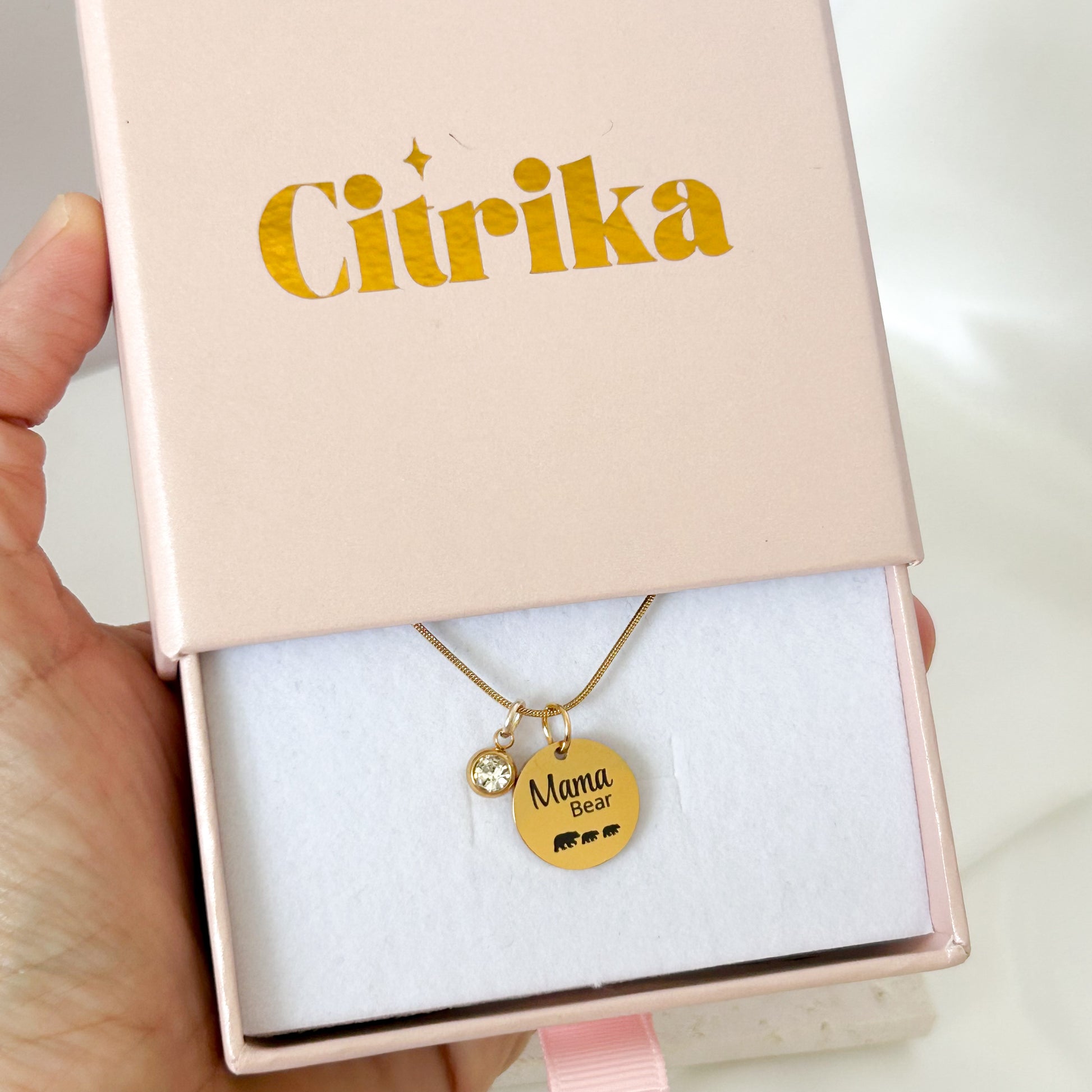 Gold necklace with 'Mama Bear' pendant in a Citrika box