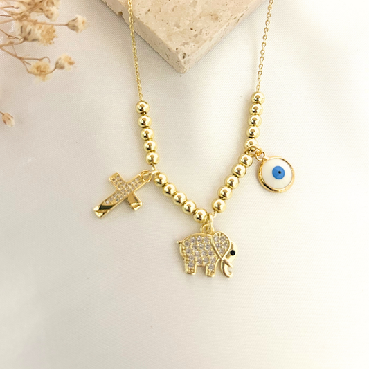 Lucky elephant necklace with cross and evil eye charms on gold chain
