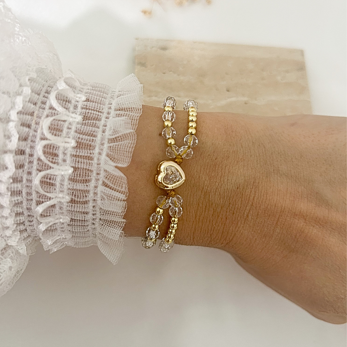 Crystal beaded bracelet with copper heart charm, adjustable cord