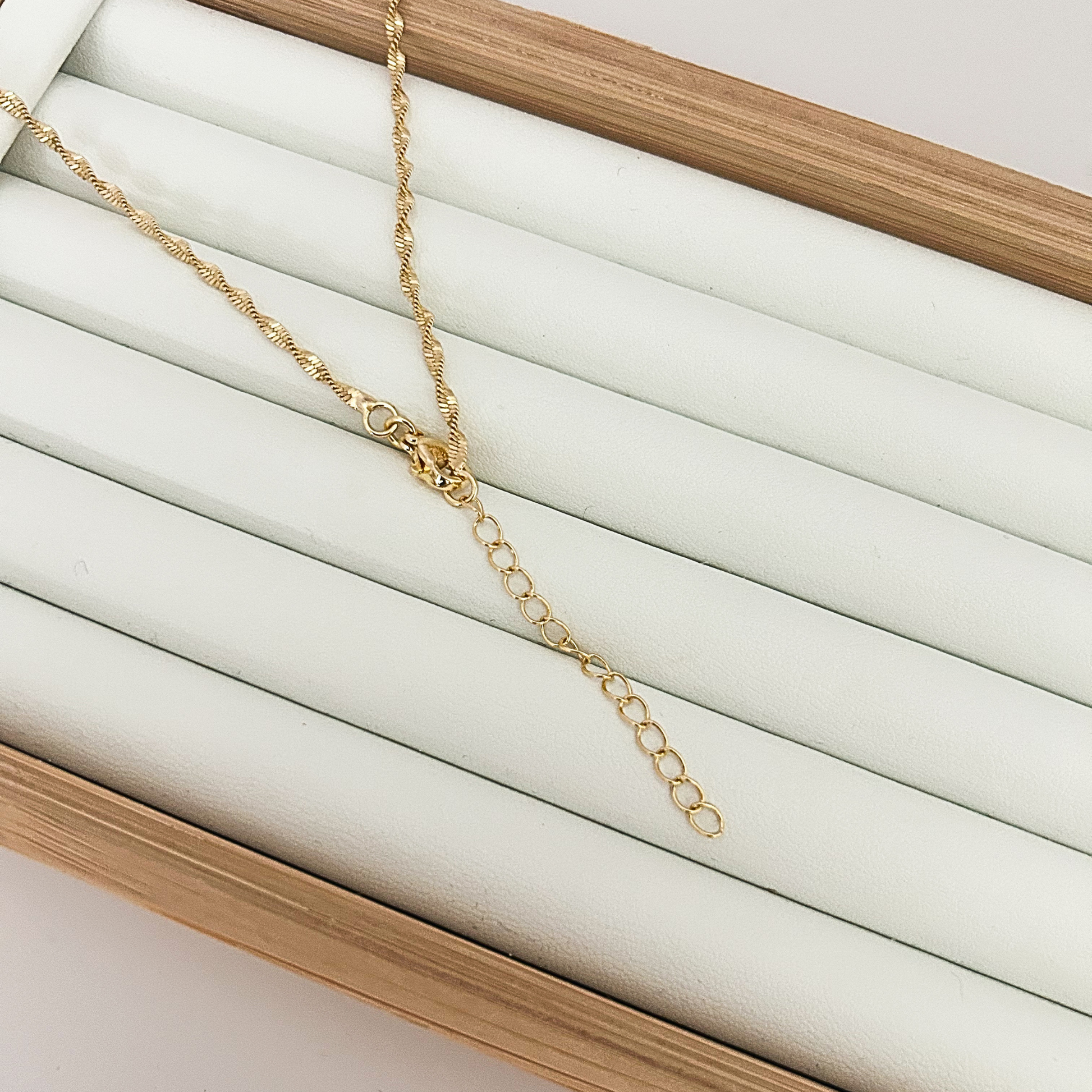 Adjustable gold necklace chain with Christian cross pendant jewelry.