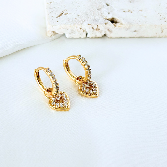 gold huggie earrings with small heart charm dainty everyday style