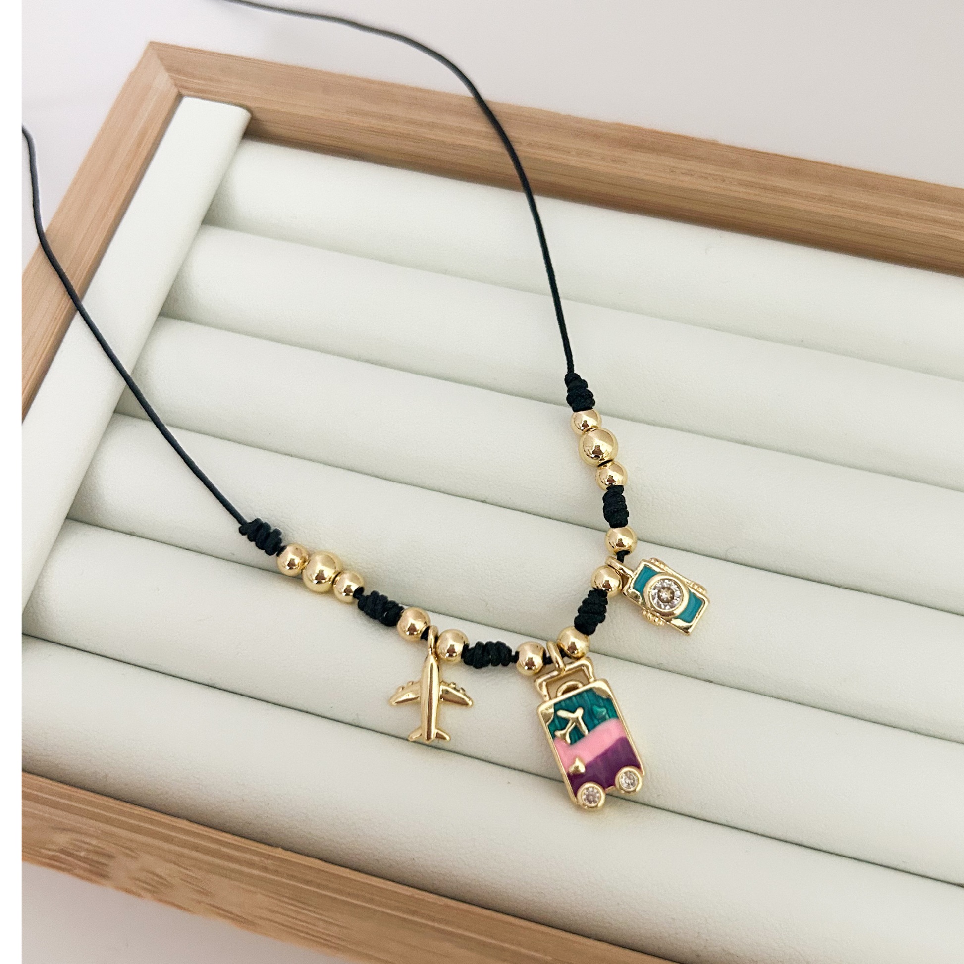 black cord necklace with colorful charms, trendy charm necklace for women, boho gold necklace aesthetic, evil eye jewelry necklace, everyday statement necklace