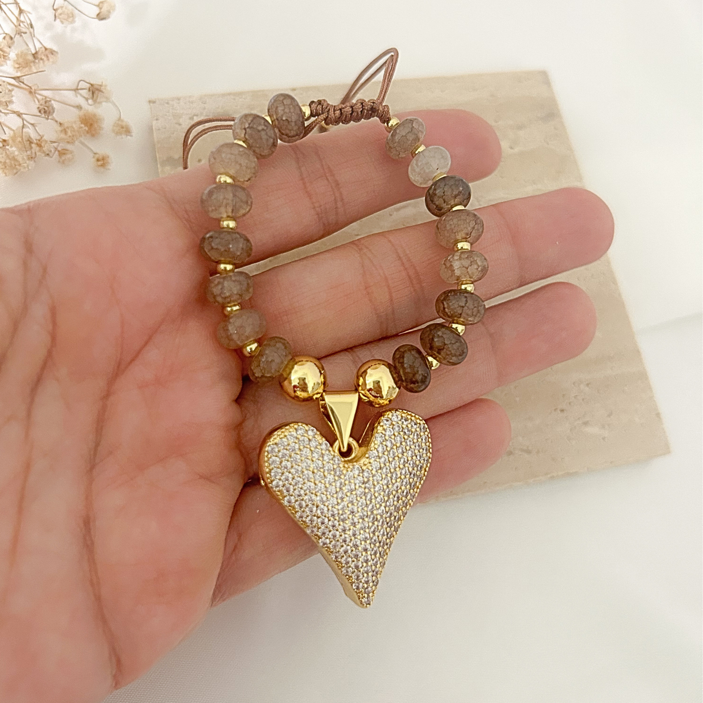 Beaded bracelet with stone-imitation beads and oversized pavé heart pendant