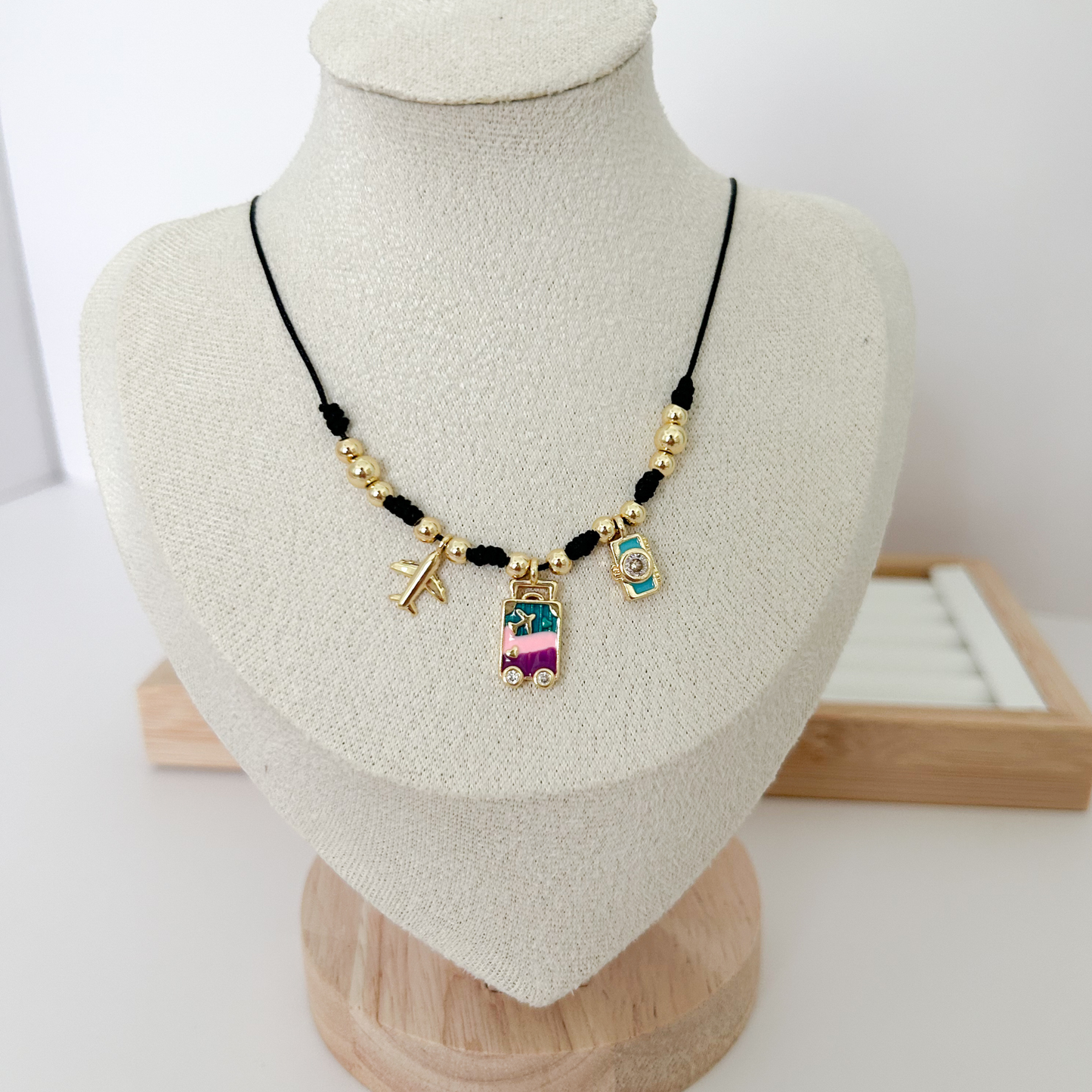 black cord necklace with colorful charms, trendy charm necklace for women, boho gold necklace aesthetic, evil eye jewelry necklace, everyday statement necklace