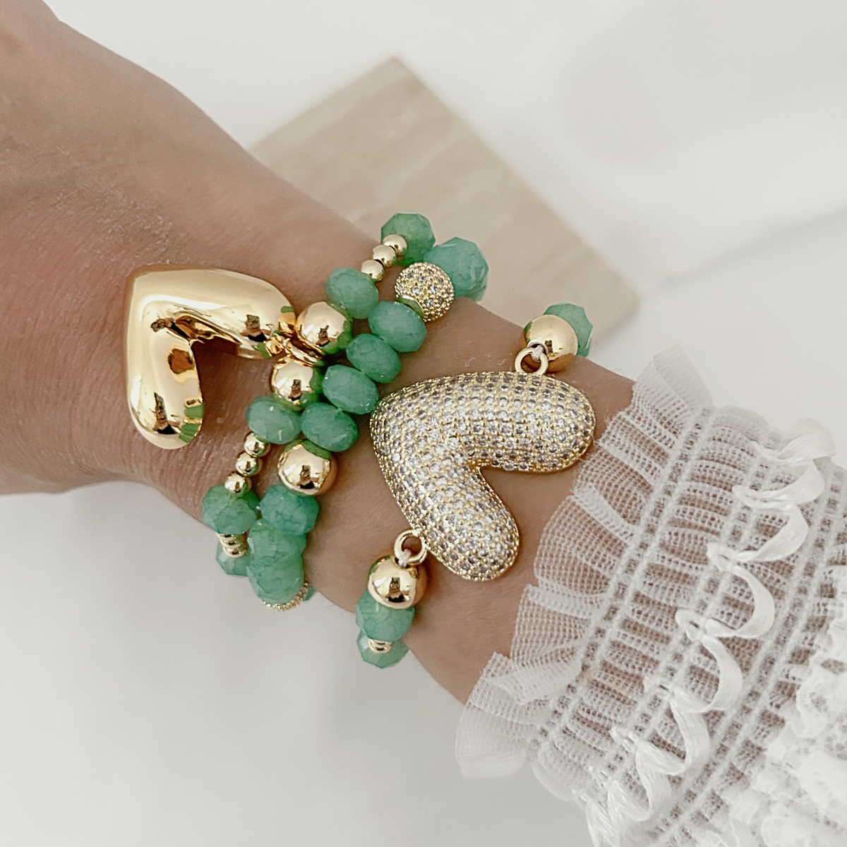 Jade bead bracelet stack with heart charm styles worn on wrist