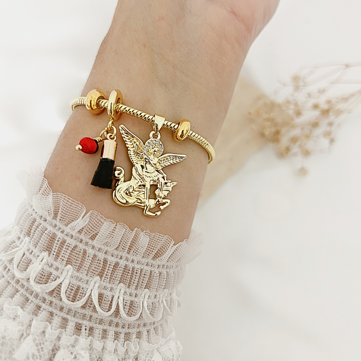 Archangel Michael charm bracelet worn on the wrist