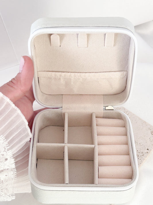 White jewelry organizer with compartments on a white background
