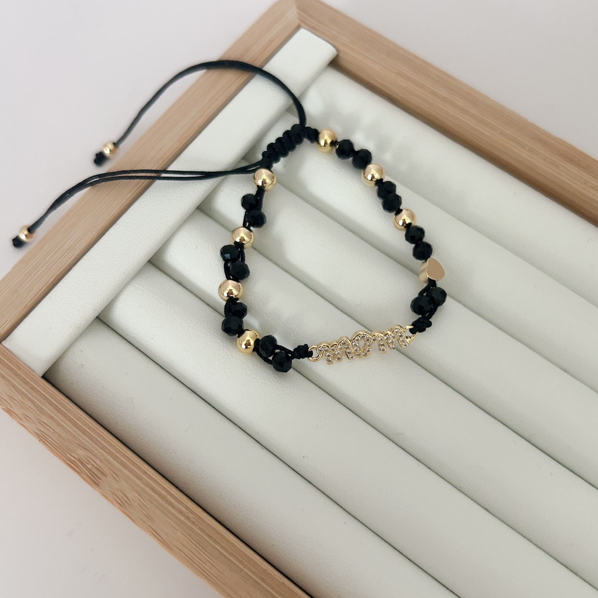 black beaded bracelet with gold details, trendy black bracelet for women, gold and black jewelry bracelet, minimalist beaded bracelet, everyday bracelet aesthetic