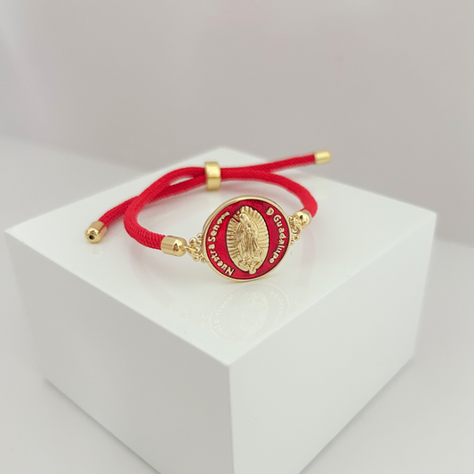 Adjustable red cord bracelet featuring Our Lady of Guadalupe medallion with gold-tone details.