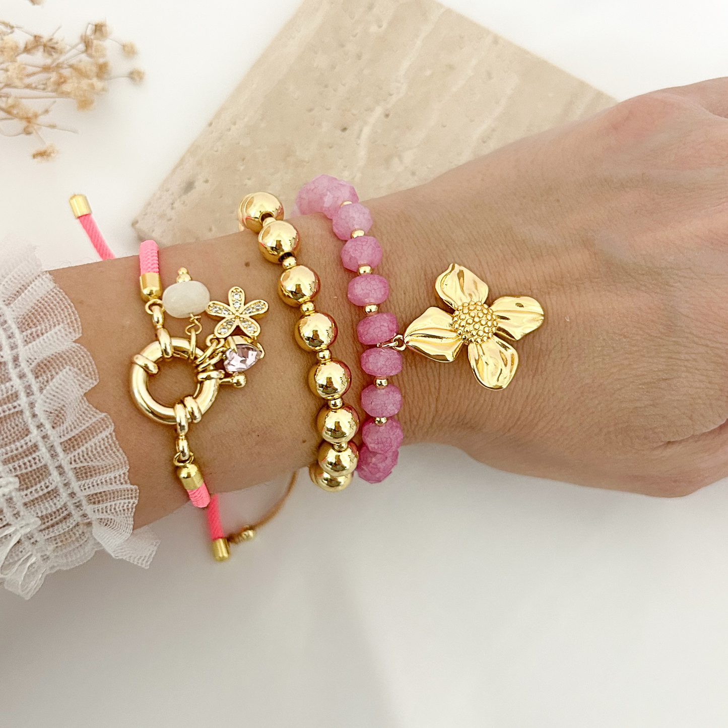 Close-up of Blush Bloom bracelet set on wrist